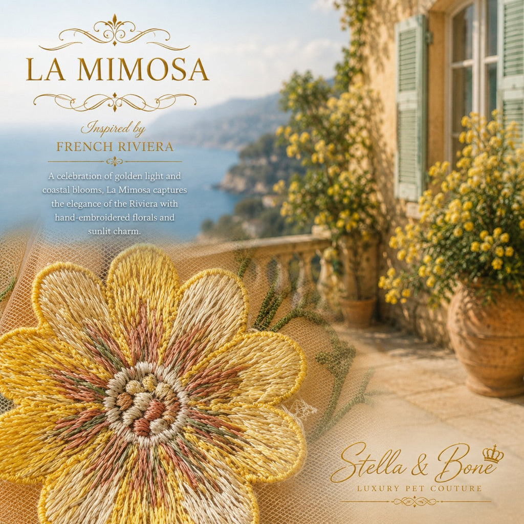 Close-up of La Mimosa luxury dog wedding dress showing hand-embroidered yellow flower detail on sheer tulle outdoors.