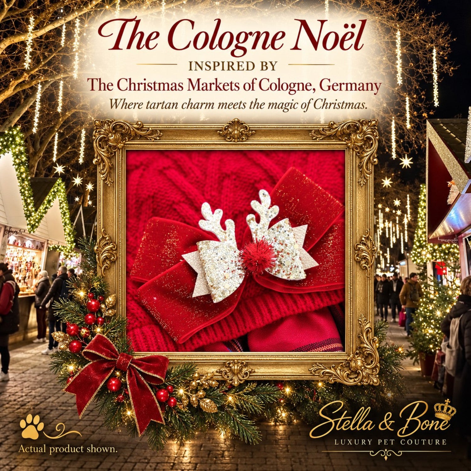 The Cologne Noel red velvet dog bow with glittery holiday reindeer antlers inside a festive gold frame