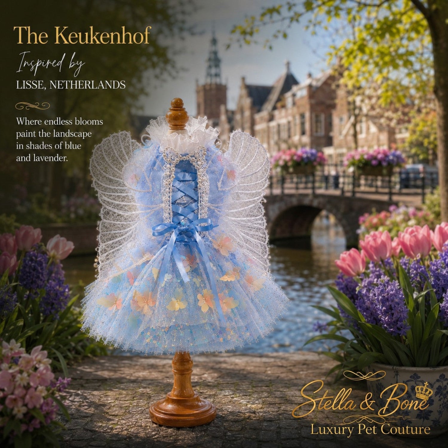 The Keukenhof luxury dog wedding dress displayed on a mannequin: a whimsical fairy-core tulle gown with lace wings.